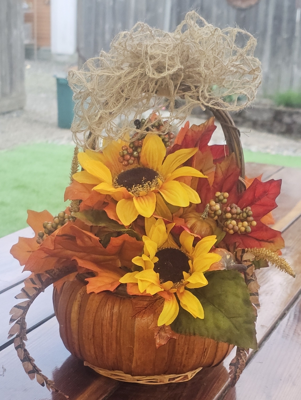 Fall Centerpiece Featuring a Faux Pumpkin Base With Sunflower and Leaf Decoratio